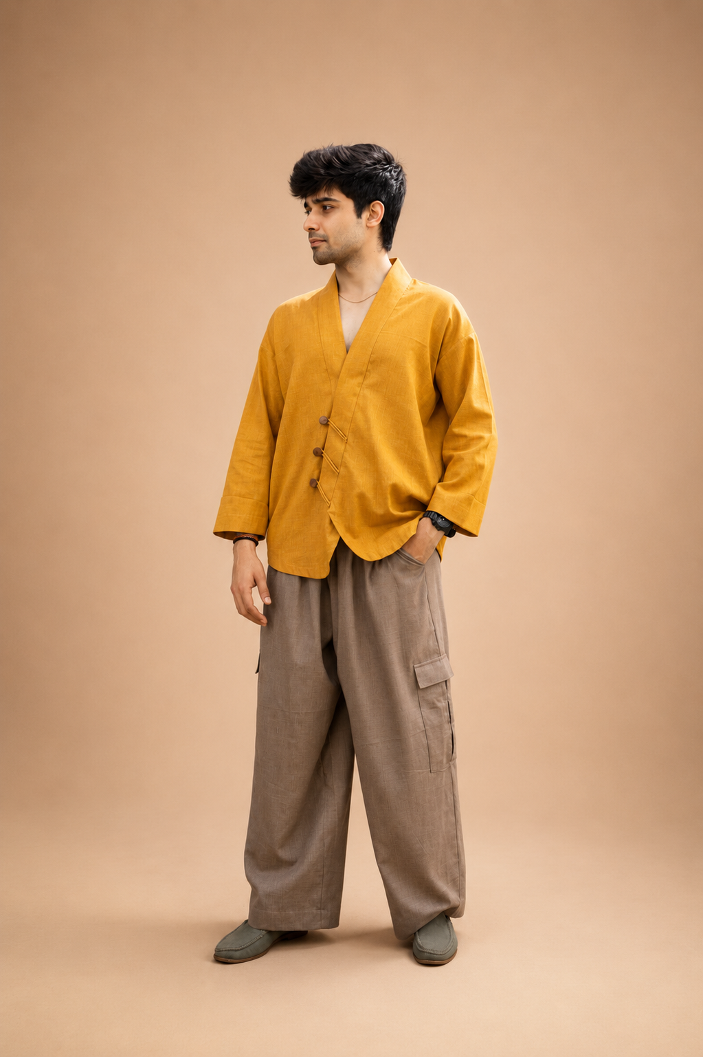 Cargo pants with functional pockets paired with an Angrakha shirt featuring wooden button detailing by Bohe by NAM.