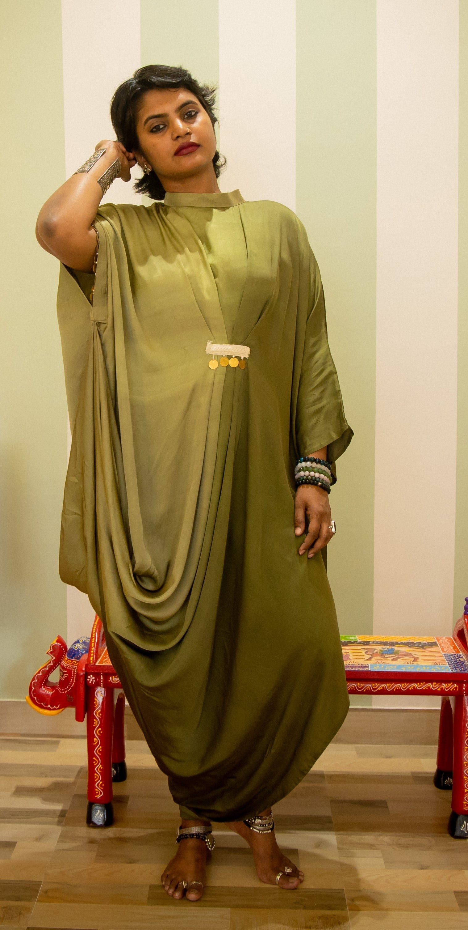 Elegant party
wear gown
for women
with sculpted
drapes and cowls