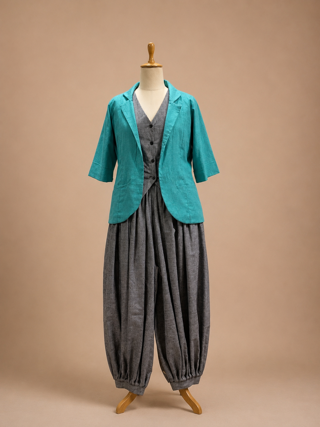Three-piece ensemble featuring balloon pants, a structured waistcoat, and a tailored jacket with a contemporary artisanal silhouette by Bohe by NAM.