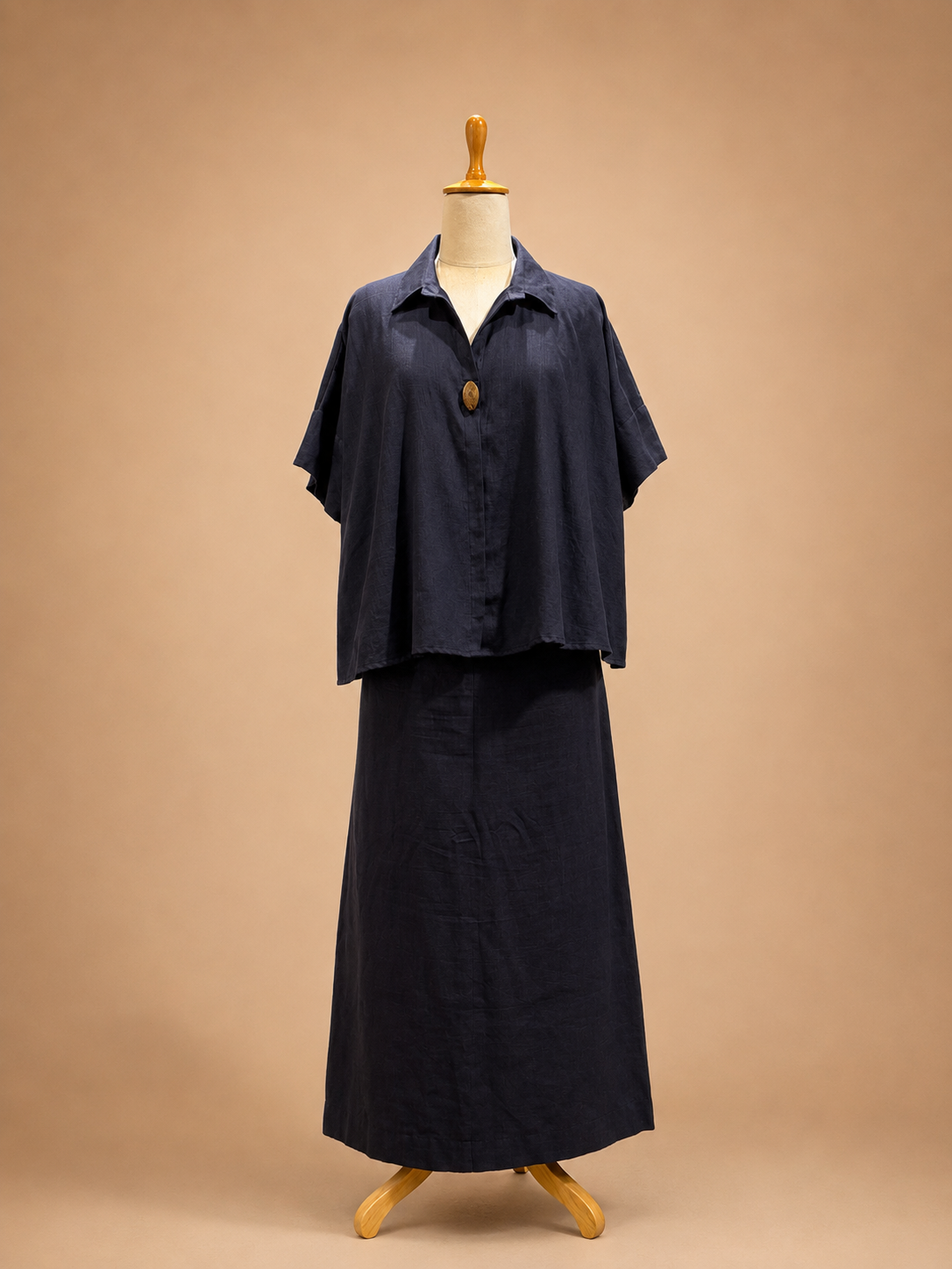 Grey khadi poncho top paired with a fitted skirt, featuring a fluid silhouette and contemporary artisanal design by Bohe by NAM.