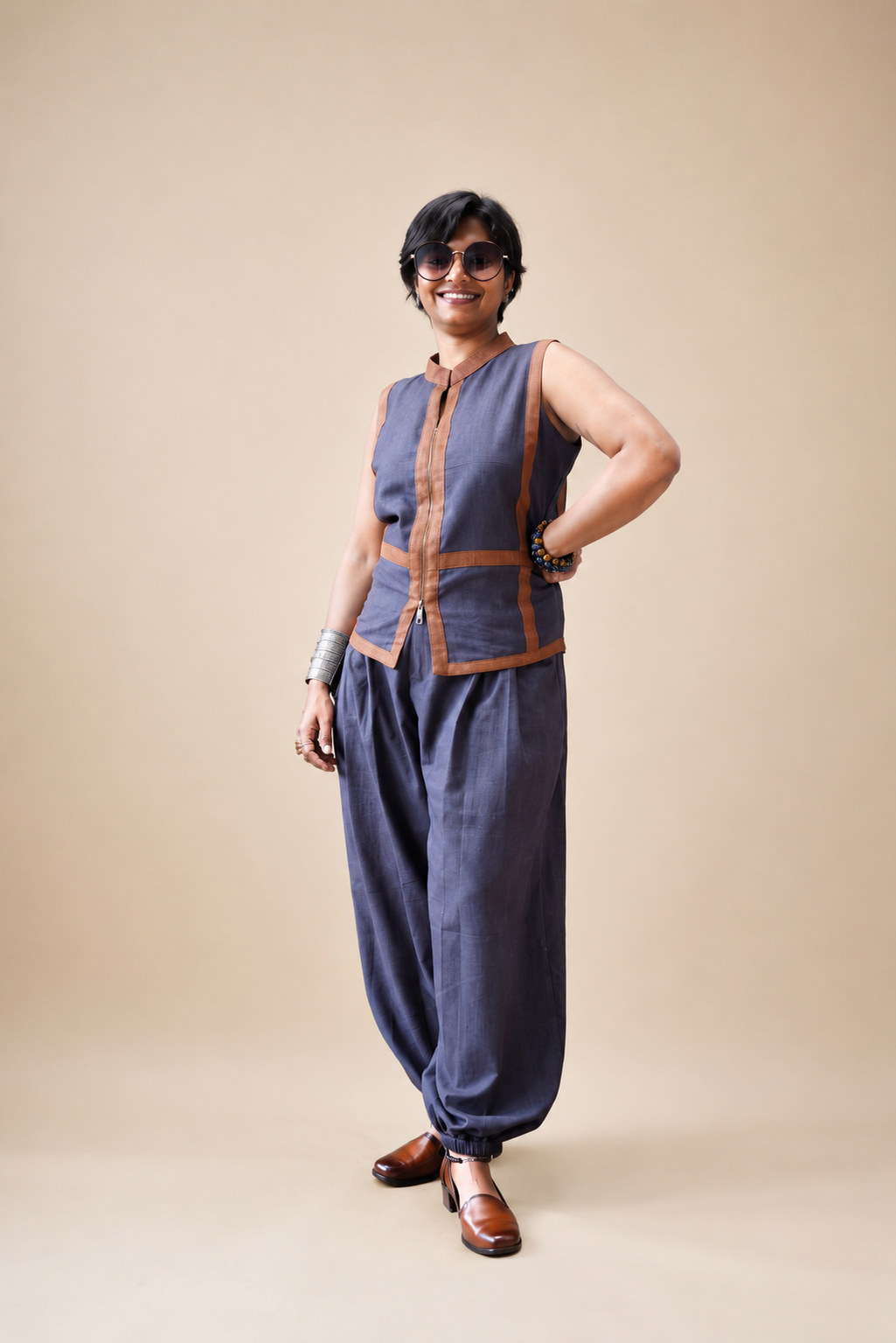 Balloon pants paired with a tailored sleeveless jacket featuring stitched jute panel detailing and a contemporary artisanal silhouette by Bohe by NAM.